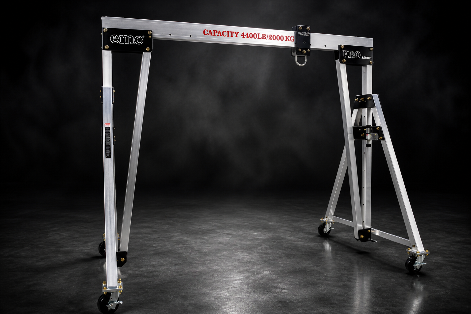 eme aluminum A-frame gantry crane, 4,400 lb capacity, studio shot on dark seamless
