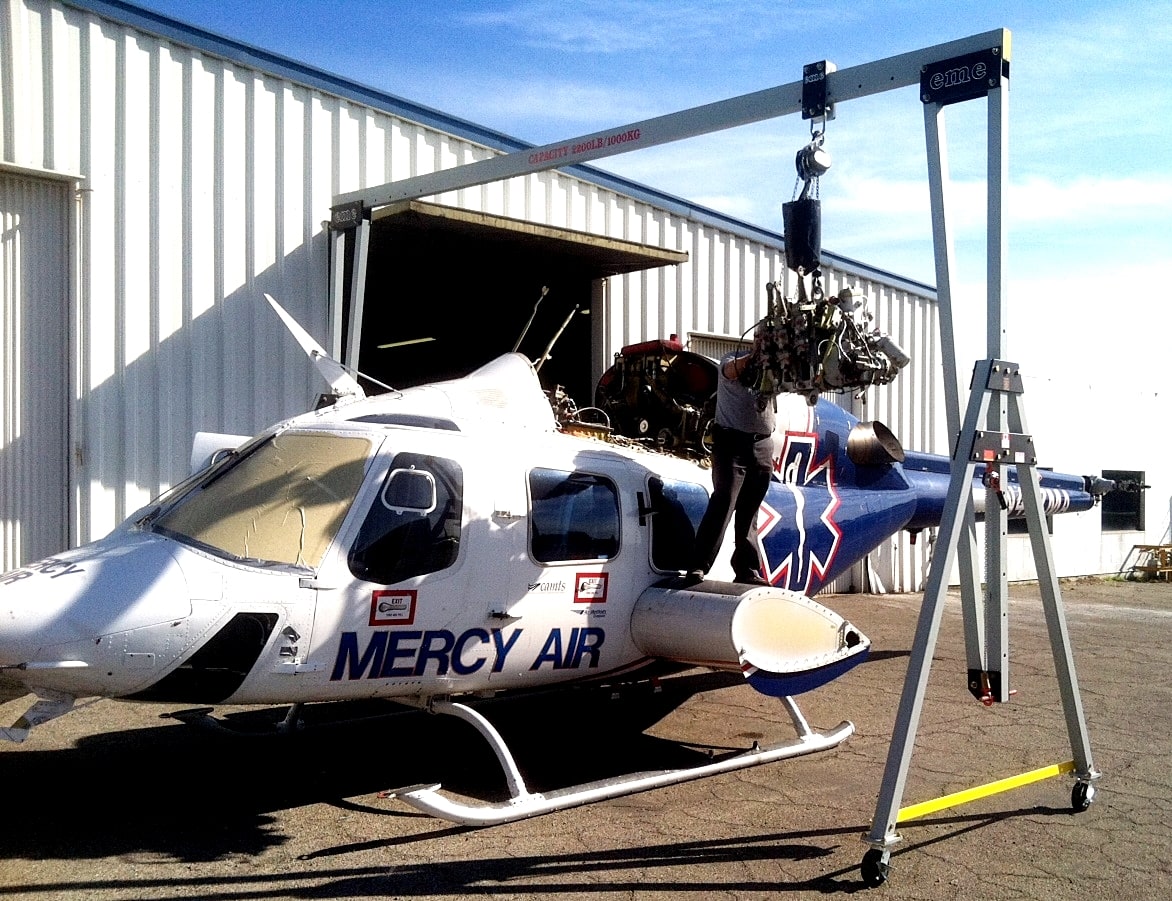 eme aluminum gantry with a split beam positioned over a helicopter for a component lift